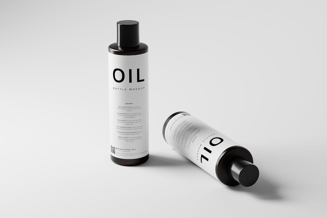 Two amber bottles mocked up with a plain oil label